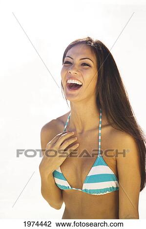 Stock Image - Hawaii, Oahu, Lanikai, Headshot Of Attractive Young Woman.. Fotosearch
