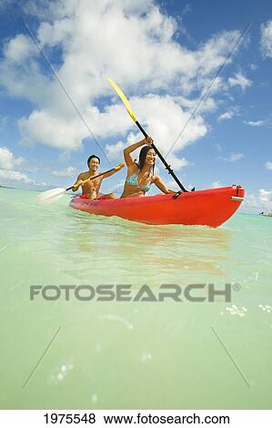 Hawaii, Oahu, Lanikai, Japanese Couple Kayaking In The Ocean. View Large Photo Image Stock Photo - Hawaii, Oahu, Lanikai, Japanese Couple Kayaking In The Ocean.. Fotosearch