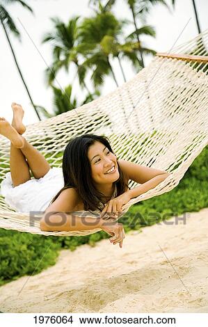 Hawaii, Oahu, Lanikai, Japanese Woman In Hammock. View Large Photo Image Picture - Hawaii, Oahu, Lanikai, Japanese Woman In Hammock.. Fotosearch