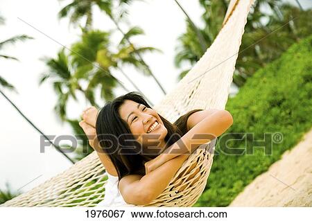 Hawaii, Oahu, Lanikai, Japanese Woman In Hammock. View Large Photo Image Stock Photo - Hawaii, Oahu, Lanikai, Japanese Woman In Hammock.. Fotosearch