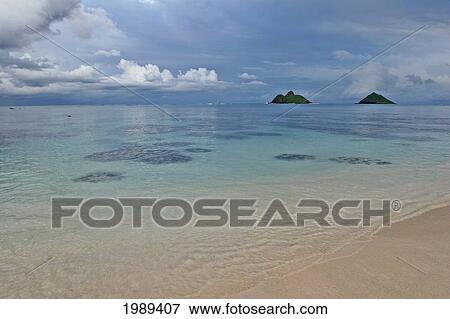 Stock Photo - Hawaii, Oahu, Lanikai, Late Afternoon View Of The Mokulua Islands.. Fotosearch