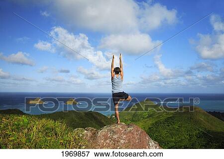 Hawaii, Oahu, Lanikai, Male Hiker Admiring View Of Doing Yoga At The Top Of The Pill Box Hike. View Large Photo Image Stock Photo - Hawaii, Oahu, Lanikai, Male Hiker Admiring View Of Doing Yoga At The Top Of The Pill Box Hike.. Fotosearch