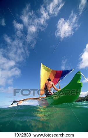 Hawaii, Oahu, Lanikai, Man In Colorful Sailing Canoe. View Large Photo Image Stock Image - Hawaii, Oahu, Lanikai, Man In Colorful Sailing Canoe.. Fotosearch