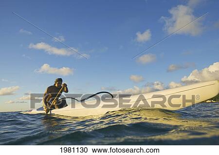 Hawaii, Oahu, Lanikai, Man Paddling One Man Outrigger Canoe. View Large Photo Image Stock Image - Hawaii, Oahu, Lanikai, Man Paddling One Man Outrigger Canoe.. Fotosearch