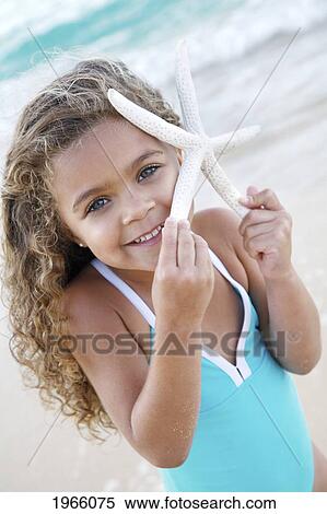 Hawaii, Oahu, Lanikai, /Nyoung Girl With Starfish At Beach. View Large Photo Image Stock Photography - Hawaii, Oahu, Lanikai, /Nyoung Girl With Starfish At Beach.. Fotosearch