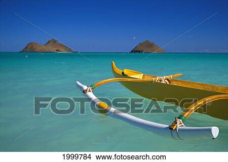 Hawaii, Oahu, Lanikai, Outrigger Canoe In Turquoise Ocean Mokulua Islands Background D1418 View Large Photo Image Picture - Hawaii, Oahu, Lanikai, Outrigger Canoe In Turquoise Ocean Mokulua Islands Background D1418. Fotosearch