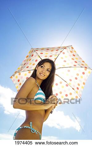 Hawaii, Oahu, Lanikai, Portrait Of Attractive Young Woman Holding An Umbrella. View Large Photo Image Stock Photography - Hawaii, Oahu, Lanikai, Portrait Of Attractive Young Woman Holding An Umbrella.. Fotosearch