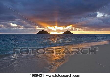 Hawaii, Oahu, Lanikai, Sunrise With The Mokulua Islands In The Distance. View Large Photo Image Stock Image - Hawaii, Oahu, Lanikai, Sunrise With The Mokulua Islands In The Distance.. Fotosearch
