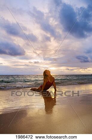 Hawaii, Oahu, Lanikai, Woman Doing Yoga On The Beach At Sunrise. View Large Photo Image Stock Image - Hawaii, Oahu, Lanikai, Woman Doing Yoga On The Beach At Sunrise.. Fotosearch