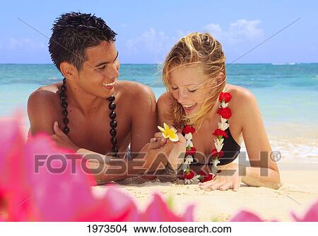 Hawaii, Oahu, Lanikai, Young Couple On The Beach. View Large Photo Image Picture - Hawaii, Oahu, Lanikai, Young Couple On The Beach.. Fotosearch