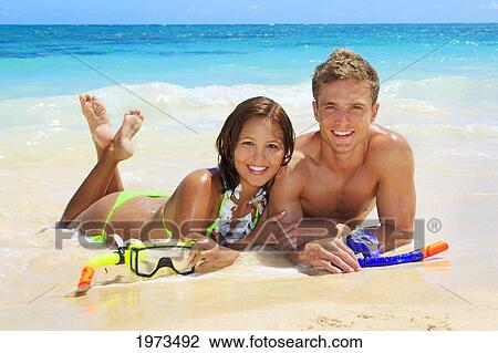 Hawaii, Oahu, Lanikai, Young Couple On The Beach With Snorkel Gear. View Large Photo Image Stock Image - Hawaii, Oahu, Lanikai, Young Couple On The Beach With Snorkel Gear.. Fotosearch