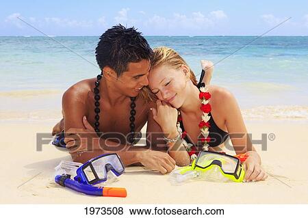 Hawaii, Oahu, Lanikai, Young Couple On The Beach With Snorkel Gear. View Large Photo Image Stock Photo - Hawaii, Oahu, Lanikai, Young Couple On The Beach With Snorkel Gear.. Fotosearch