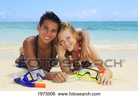 Hawaii, Oahu, Lanikai, Young Couple On The Beach With Snorkel Gear. View Large Photo Image Stock Photograph - Hawaii, Oahu, Lanikai, Young Couple On The Beach With Snorkel Gear.. Fotosearch