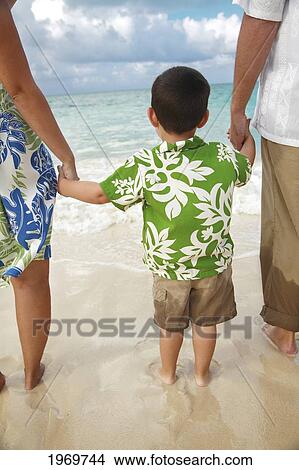 Hawaii, Oahu, Lanikai, Young Family Strolling Along The Beach, View From Behind. View Large Photo Image Picture - Hawaii, Oahu, Lanikai, Young Family Strolling Along The Beach, View From Behind.. Fotosearch
