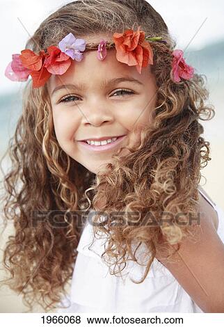Stock Photo - Hawaii, Oahu, Lanikai, Young Girl Wears Flower Headband At Beach.. Fotosearch