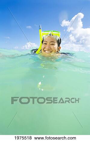 Hawaii, Oahu, Lanikai, Young Japanese Woman Wearing Snorkle Gear In The Ocean. View Large Photo Image Stock Photo - Hawaii, Oahu, Lanikai, Young Japanese Woman Wearing Snorkle Gear In The Ocean.. Fotosearch