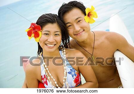 Hawaii, Oahu, Lanikai, Young Japanese Couple Holding Surfboards. View Large Photo Image Stock Photograph - Hawaii, Oahu, Lanikai, Young Japanese Couple Holding Surfboards.. Fotosearch