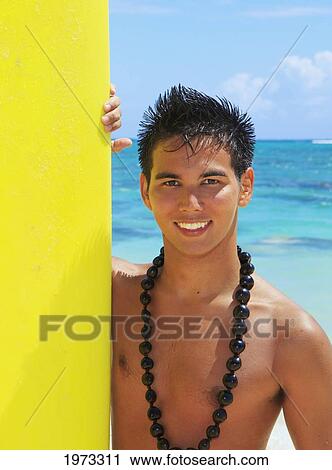 Stock Image - Hawaii, Oahu, Lanikai, Young Man At The Beach With Surfboard.. Fotosearch