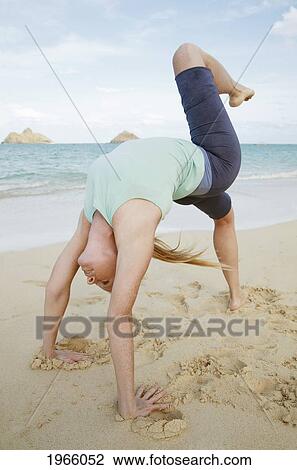 Hawaii, Oahu, Lanikai, Young Woman Does Yoga On The Beach. View Large Photo Image Stock Image - Hawaii, Oahu, Lanikai, Young Woman Does Yoga On The Beach.. Fotosearch