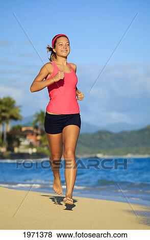 Hawaii, Oahu, Lanikai, Young Woman Running On Beach. View Large Photo Image Stock Photo - Hawaii, Oahu, Lanikai, Young Woman Running On Beach.. Fotosearch