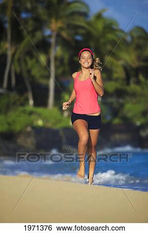 Hawaii, Oahu, Lanikai, Young Woman Running On Beach. View Large Photo Image Stock Photograph - Hawaii, Oahu, Lanikai, Young Woman Running On Beach.. Fotosearch