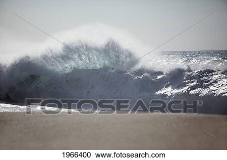 Hawaii, Oahu, Large Wave Crashing On Beach In Fan Shape. View Large Photo Image Stock Image - Hawaii, Oahu, Large Wave Crashing On Beach In Fan Shape.. Fotosearch
