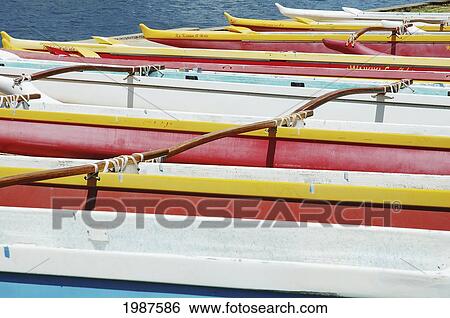 Hawaii, Oahu, Lineup Of Colorful Outrigger Canoes View Large Photo Image Stock Photograph - Hawaii, Oahu, Lineup Of Colorful Outrigger Canoes. Fotosearch