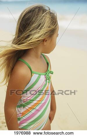 Stock Photo - Hawaii, Oahu, Little Girl Poses On Beach.. Fotosearch