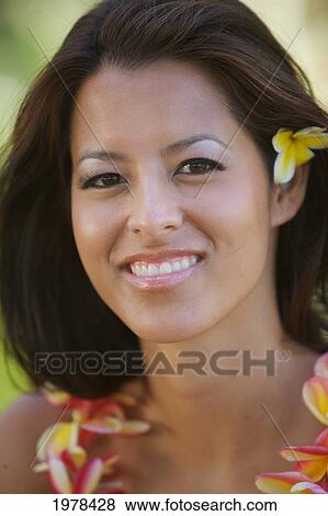 Hawaii, Oahu, Local Girl With Yellow Plumeria Behind Her Ear And A Plumeria Lei Around Her Neck. View Large Photo Image Stock Photo - Hawaii, Oahu, Local Girl With Yellow Plumeria Behind Her Ear And A Plumeria Lei Around Her Neck.. Fotosearch