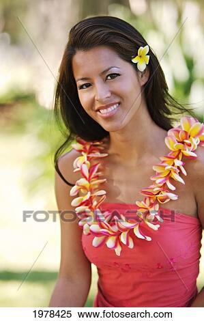 Hawaii, Oahu, Local Girl With Yellow Plumeria Behind Her Ear And A Plumeria Lei Around Her Neck. View Large Photo Image Stock Photography - Hawaii, Oahu, Local Girl With Yellow Plumeria Behind Her Ear And A Plumeria Lei Around Her Neck.. Fotosearch