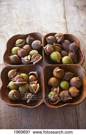 Stock Photo - Hawaii, Oahu, Macadamia Nuts In A Beautiful Wooden Platter.. Fotosearch