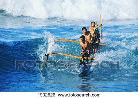 Hawaii, Oahu, Makaha Beach, Three Local Men In Outrigger Canoe Surfing Wave, Front View, Rolling Whitewash. View Large Photo Image Stock Photograph - Hawaii, Oahu, Makaha Beach, Three Local Men In Outrigger Canoe Surfing Wave, Front View, Rolling Whitewash.. Fotosearch