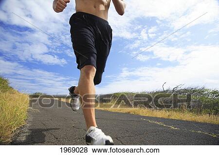Hawaii, Oahu, Makapu'u, Athletic Male Running Along The Makapuu Hiking Trail, Closeup Of Feet View Large Photo Image Stock Photo - Hawaii, Oahu, Makapu'u, Athletic Male Running Along The Makapuu Hiking Trail, Closeup Of Feet. Fotosearch