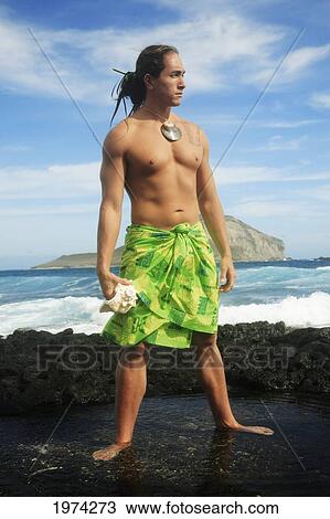 Hawaii, Oahu, Makapuu, Polynesian Man In Traditional Hawaiian Clothing On Rocky Shore. View Large Photo Image Stock Image - Hawaii, Oahu, Makapuu, Polynesian Man In Traditional Hawaiian Clothing On Rocky Shore.. Fotosearch