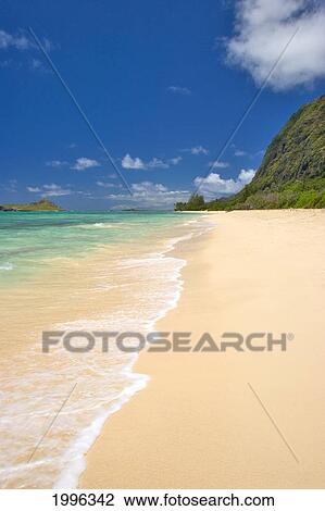 Stock Image - Hawaii, Oahu, Makapu'u, Rabbit Island In Background, Wave Washes Over Gold Sand Beach. Fotosearch
