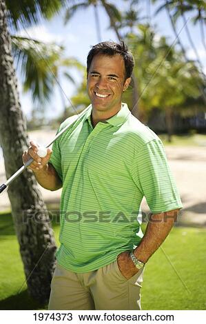 Stock Image - Hawaii, Oahu, Male Golfer On Golf Course.. Fotosearch