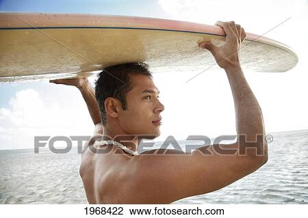 Hawaii, Oahu, Male Holding His Surfboard At The Beach. View Large Photo Image Stock Image - Hawaii, Oahu, Male Holding His Surfboard At The Beach.. Fotosearch