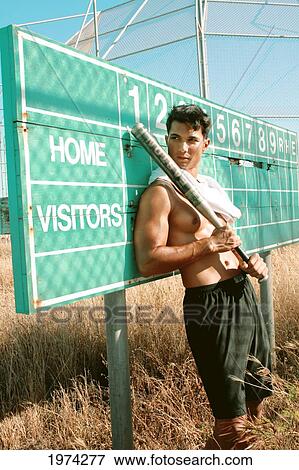 Hawaii, Oahu, Male Leaning Against Old Baseball Field Scoreboard With Bat In Hands. View Large Photo Image Stock Photo - Hawaii, Oahu, Male Leaning Against Old Baseball Field Scoreboard With Bat In Hands.. Fotosearch