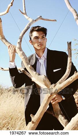 Stock Photo - Hawaii, Oahu, Male Posing In The Center Of A Desert.. Fotosearch