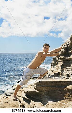 Hawaii, Oahu, Male Rock Climbing. View Large Photo Image Stock Photo - Hawaii, Oahu, Male Rock Climbing.. Fotosearch