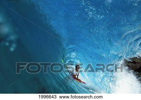 Stock Image - Hawaii, Oahu, Morey Contest Lanson Ronquilio, Body Boarding In The Tube. Fotosearch