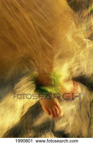 Hawaii, Oahu, Motion Blur, View Of Feet And Skirt Hula Dancing On Rock At Kualoa Ranch View Large Photo Image Stock Image - Hawaii, Oahu, Motion Blur, View Of Feet And Skirt Hula Dancing On Rock At Kualoa Ranch. Fotosearch