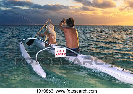 Hawaii, Oahu, Newlywed Couple Paddling An Outrigger Canoe View Large Photo Image Stock Image - Hawaii, Oahu, Newlywed Couple Paddling An Outrigger Canoe. Fotosearch