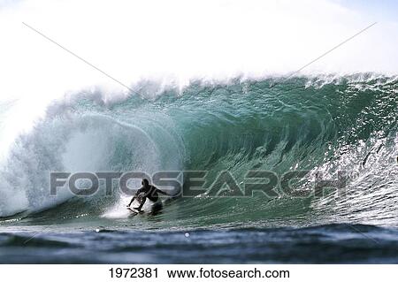 Stock Image - Hawaii, Oahu, North Shore, Afternoon Surfing On Large Waves. Editorial Use Only.. Fotosearch