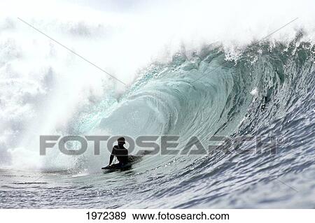 Stock Photo - Hawaii, Oahu, North Shore, Afternoon Surfing On Large Waves. Editorial Use Only.. Fotosearch