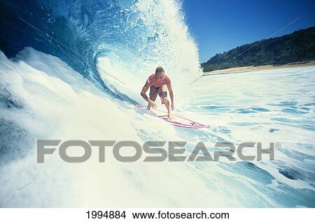 Picture - Hawaii, Oahu, North Shore, Backdoor Pipe, Noah Johnson Riding Wave. Fotosearch