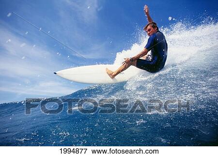 Stock Photo - Hawaii, Oahu, North Shore, Backdoor Pipe, Pancho Sullivan Riding Wave. Fotosearch