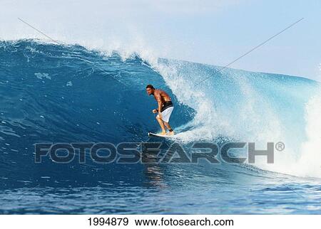 Stock Photo - Hawaii, Oahu, North Shore, Backdoor Pipe, Pancho Sullivan Riding Wave. Fotosearch