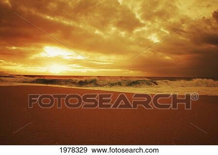 Hawaii, Oahu, North Shore, Beautiful Sunset Over The Ocean. View Large Photo Image Stock Photo - Hawaii, Oahu, North Shore, Beautiful Sunset Over The Ocean.. Fotosearch