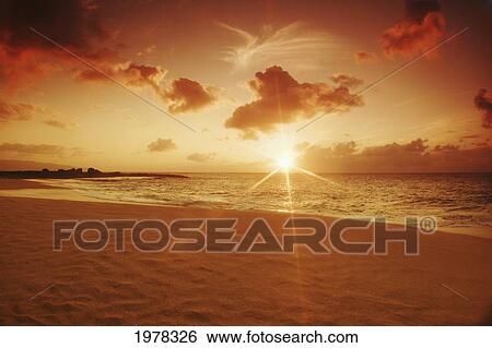 Hawaii, Oahu, North Shore, Beautiful Sunset Over The Ocean. View Large Photo Image Stock Photograph - Hawaii, Oahu, North Shore, Beautiful Sunset Over The Ocean.. Fotosearch